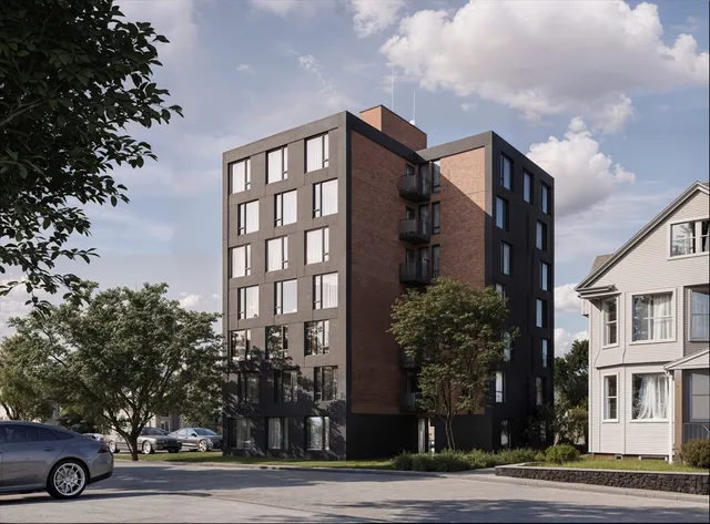 a view of a building along the street