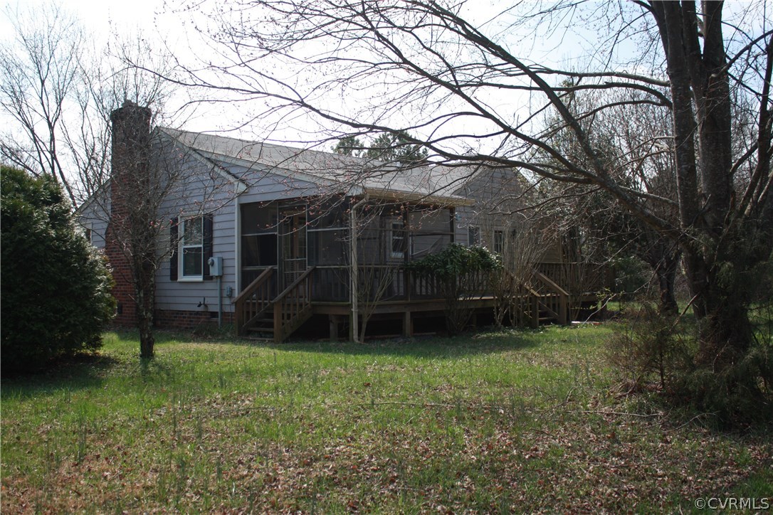 2284 Pony Farm Road Maidens, VA 23102 - Photo 12 of 14 a backyard of a house with plants and large tree