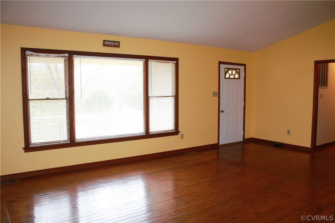 2284 Pony Farm Road Maidens, VA 23102 - Photo 3 of 14 a view of an empty room with wooden floor and a window