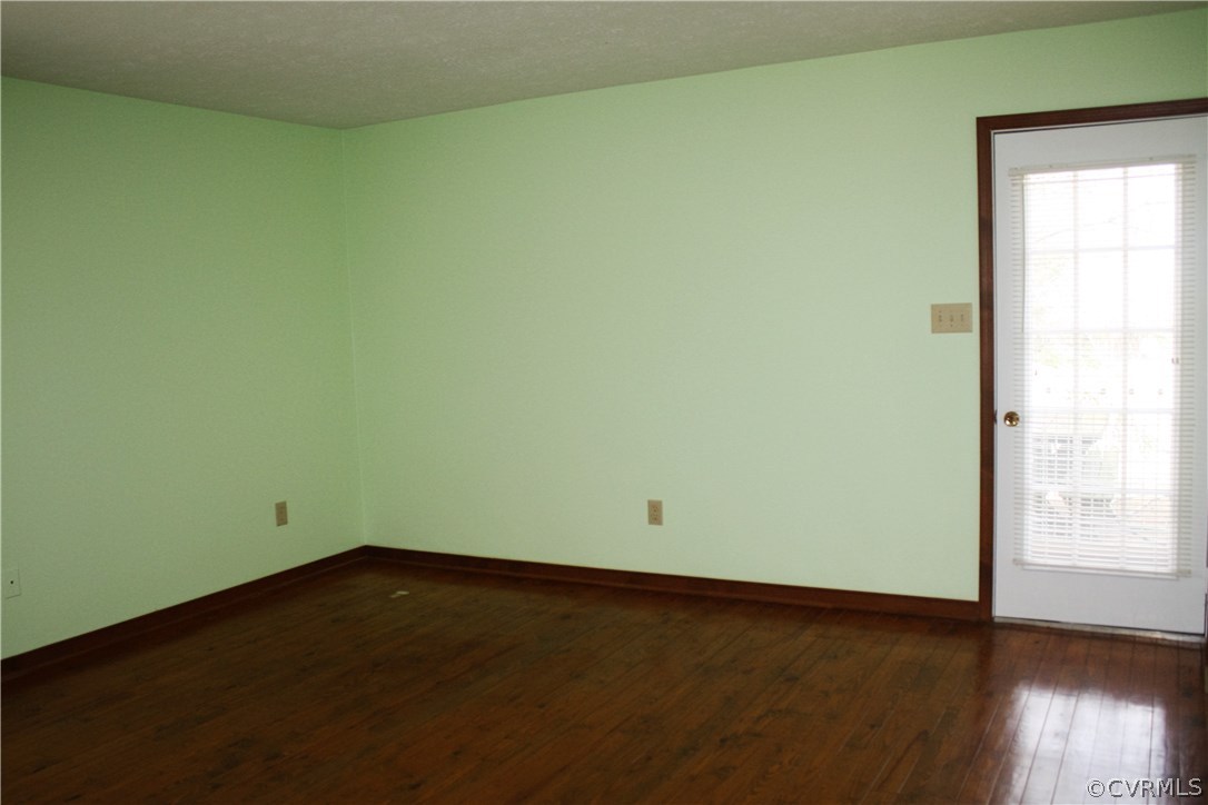 2284 Pony Farm Road Maidens, VA 23102 - Photo 7 of 14 an empty room with wooden floor and windows
