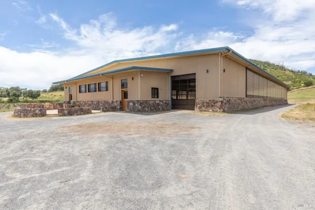 a view of a room with stairs and a chandelier