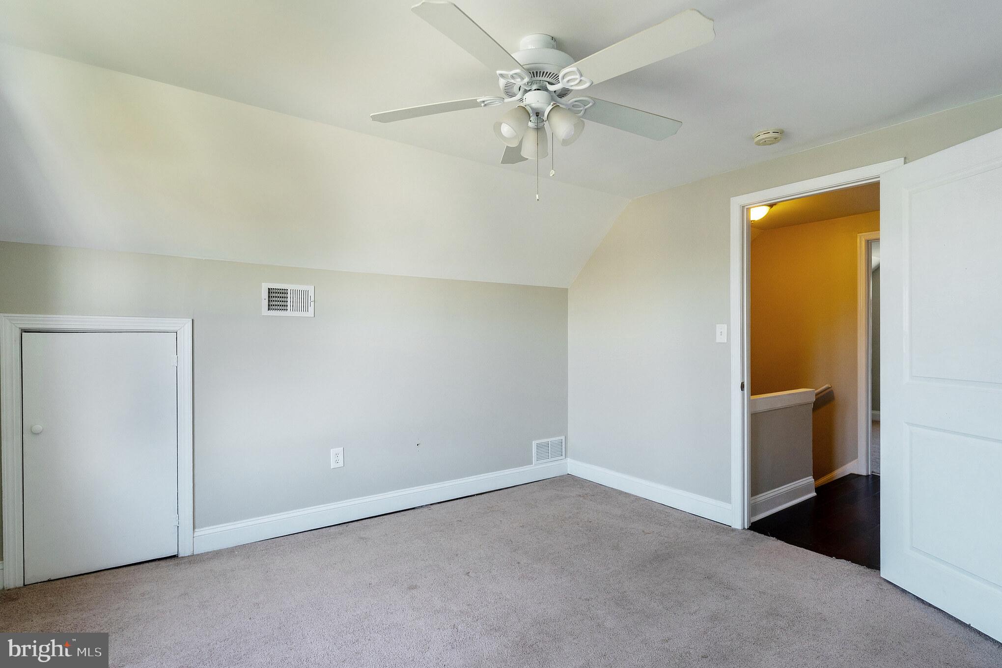 2810 Manoff Road Halethorpe, MD 21227 - Photo 16 of 27 an empty room with a ceiling fan and a window