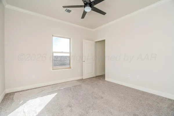 a view of an empty room with a window