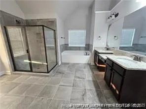 a bathroom with a sink a mirror and a bathtub