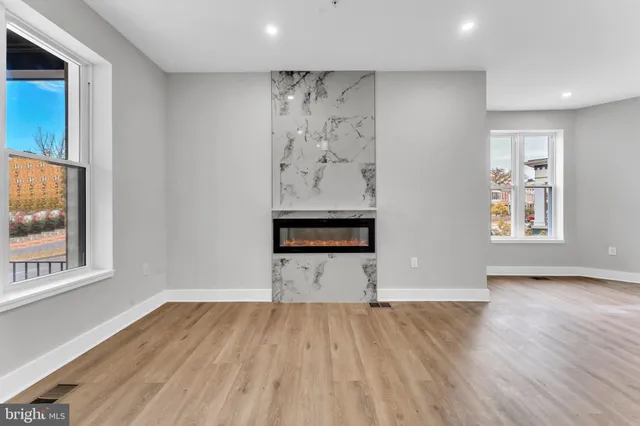 a view of a kitchen with a stove cabinets and a wooden floor
