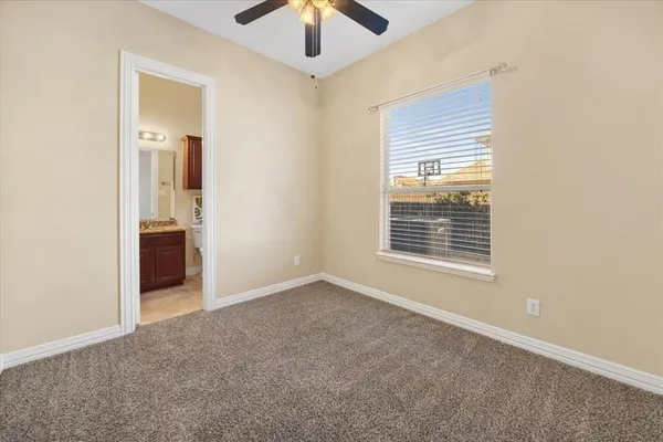 a living room with furniture and chandelier