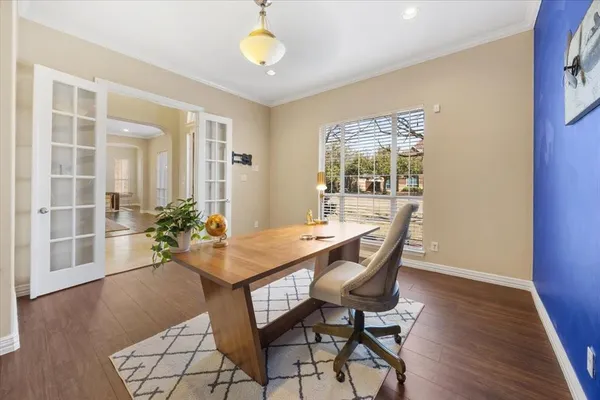 a view of a house with backyard and sitting area