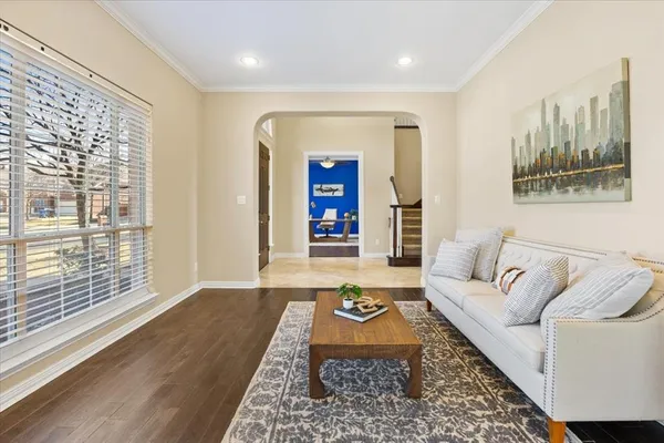 a living room with furniture and a rug