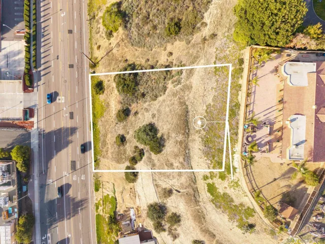 an aerial view of residential building and parking space