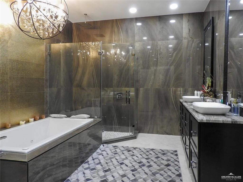 1413 Encantado Circle Palmview, TX 78572 - Photo 12 of 25 a bathroom with a sink a toilet and shower