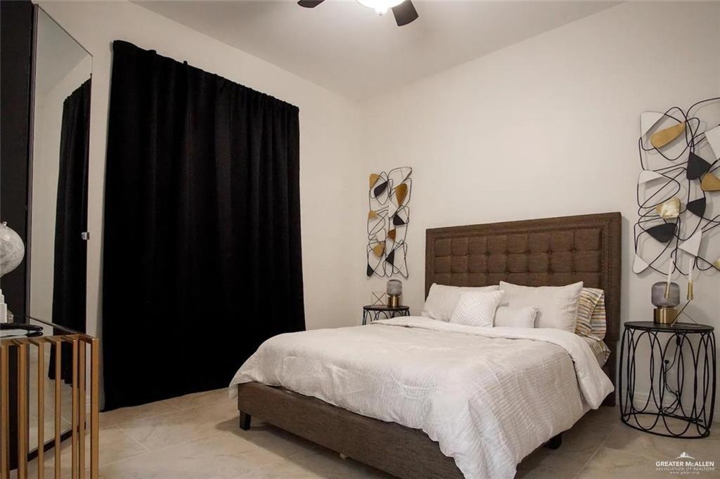 1413 Encantado Circle Palmview, TX 78572 - Photo 17 of 25 a bedroom with a bed and a dresser