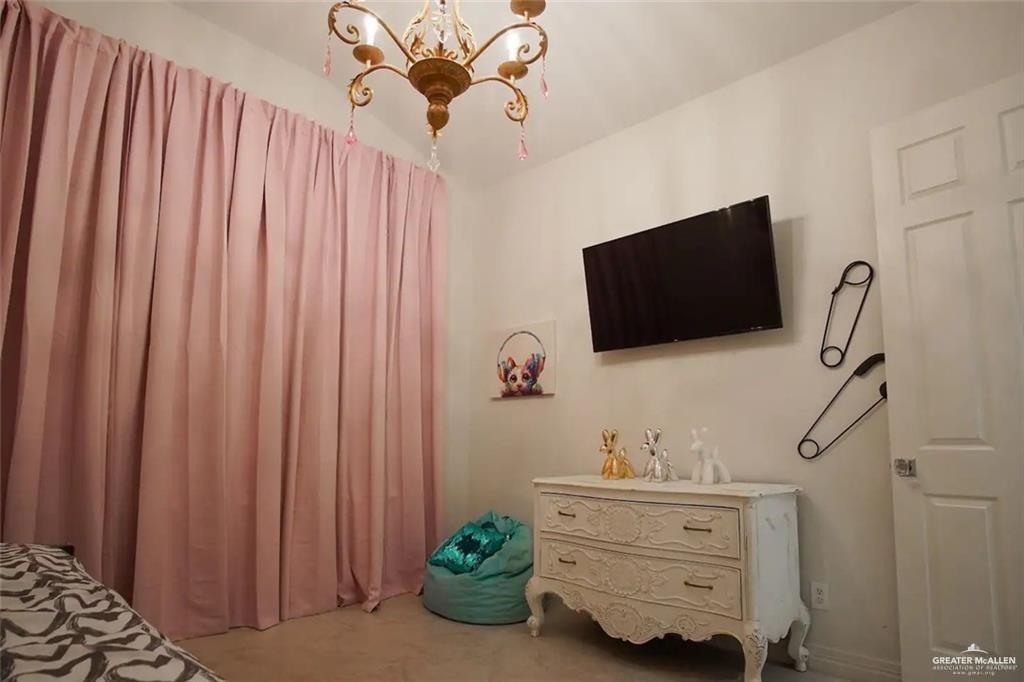 1413 Encantado Circle Palmview, TX 78572 - Photo 19 of 25 a living room with furniture and a flat screen tv