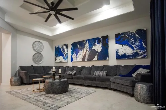a living room with furniture and wall paintings