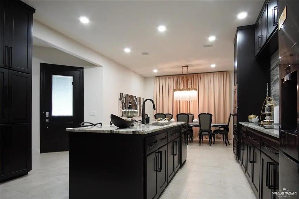 1413 Encantado Circle Palmview, TX 78572 - Photo 7 of 25 a view of a dining room with furniture