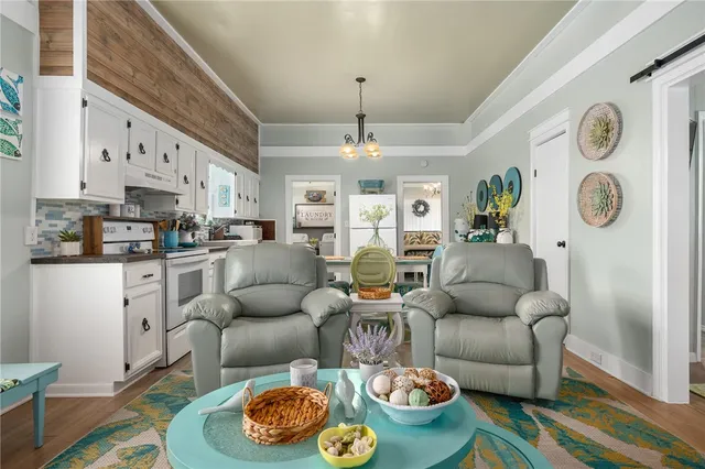 a living room with furniture and a table