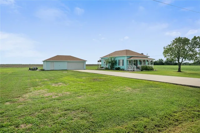 a view of outdoor space with garden and deck