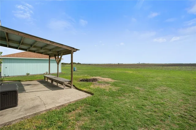 a patio with table and chairs