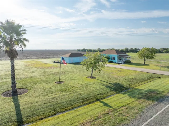 a view of a lake with a yard