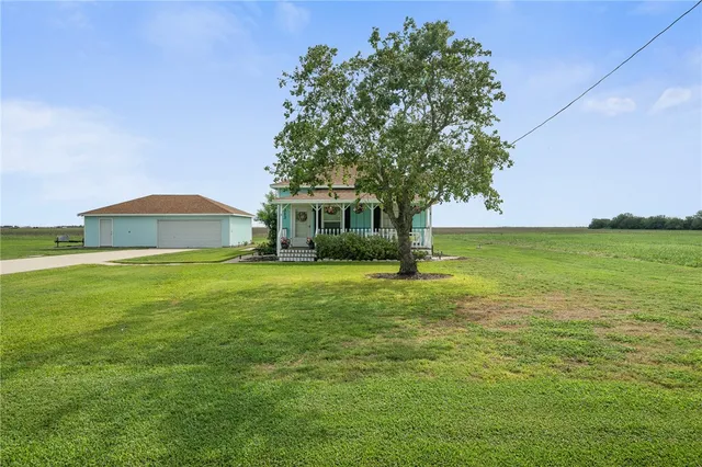 a view of a house with a big yard