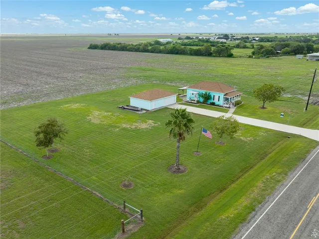 a view of a lake with a yard