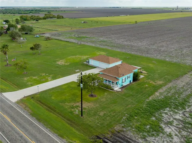 a view of a field with an ocean