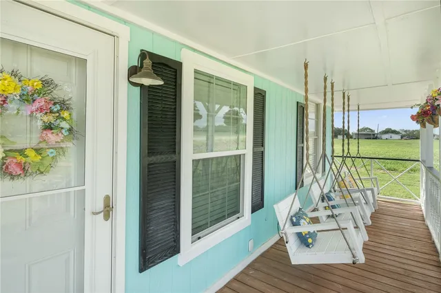 a view of balcony with furniture