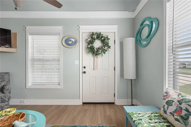 a view of room with window and wooden floor