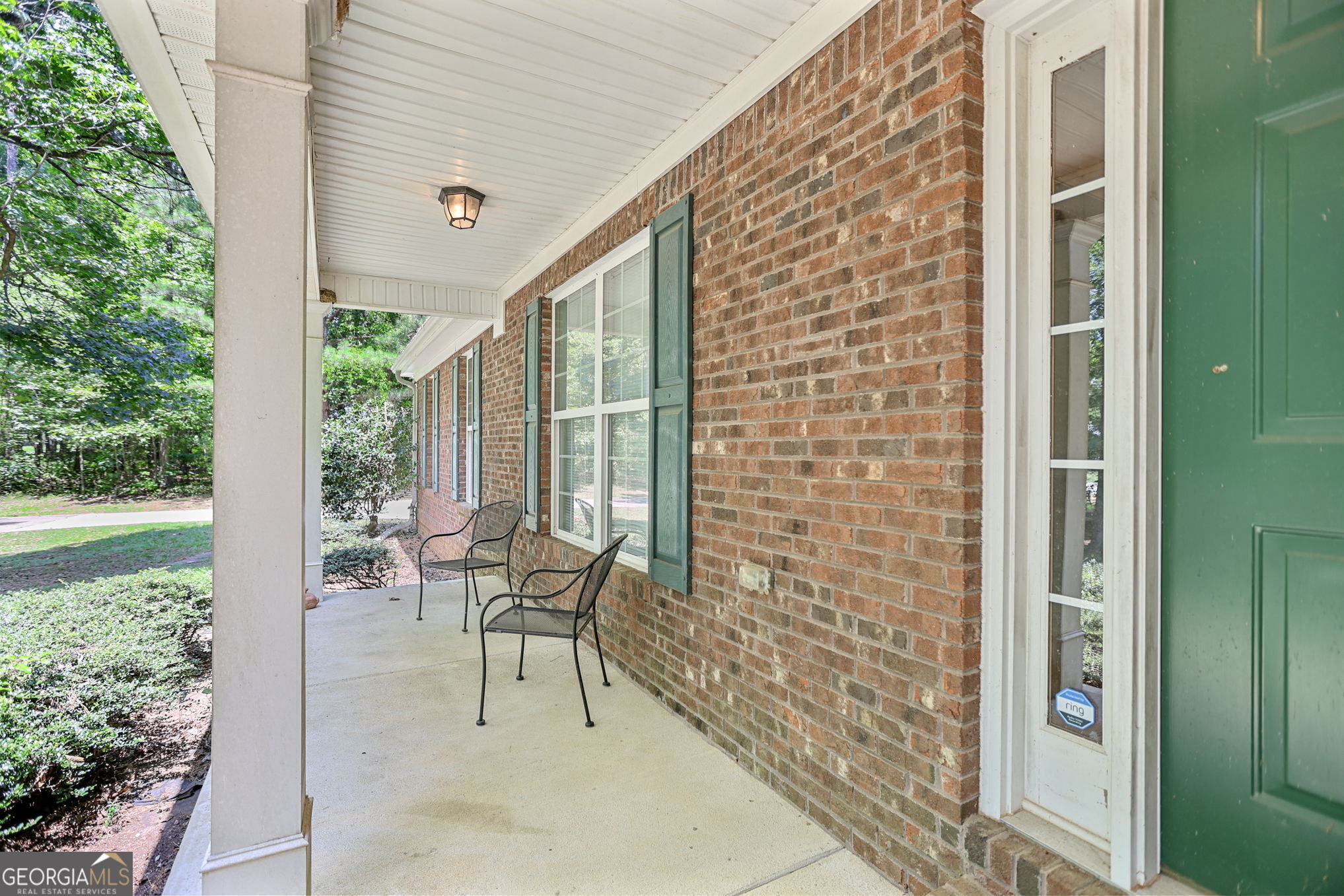 892 Brooks Woolsey Road Brooks, GA 30205 - Photo 41 of 45 a balcony with chairs and table