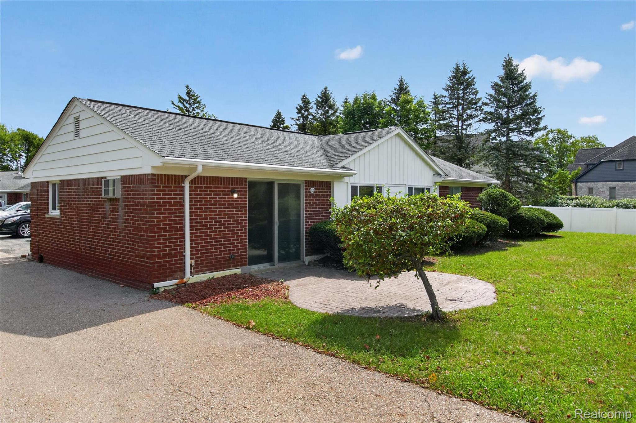 22000 Beck Road, Unit 101 Northville, MI 48167 - Photo 16 of 20 Brick exterior with white siding accents and a gray shingle roof