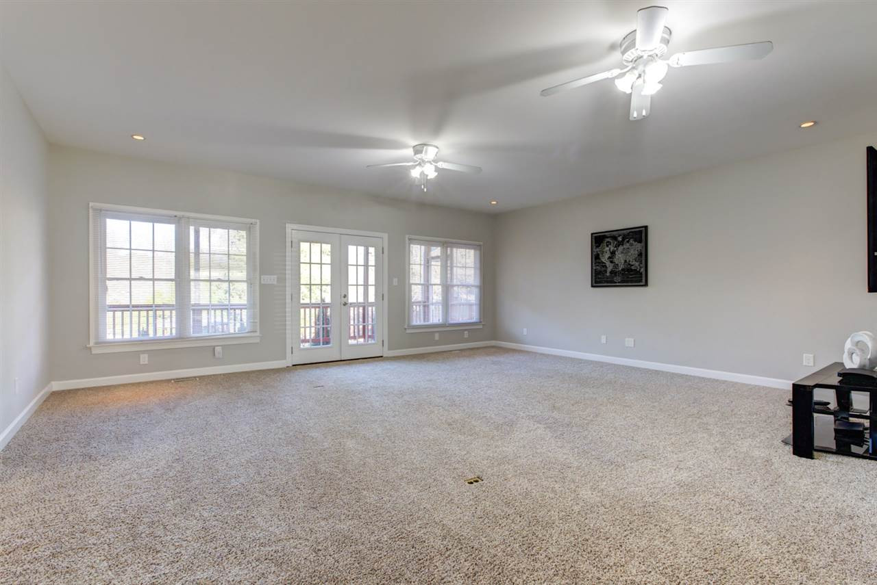 7220 Ridgeline Drive Raleigh, NC 27613 - Photo 3 of 16 The family room is huge! Plenty of space for relaxing and entertaining. Great access to the deck makes grilling out a breeze. Den/Family/Great Room