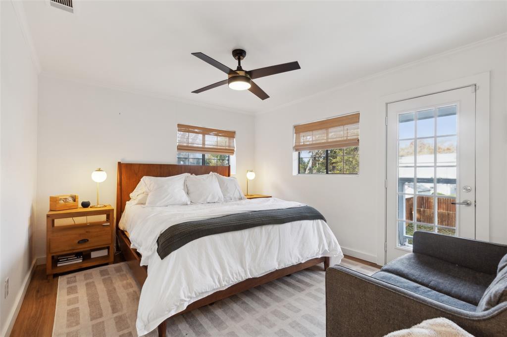 9427 Hobart Street Dallas, TX 75218 - Photo 11 of 25 a bed room with a bed and a couch