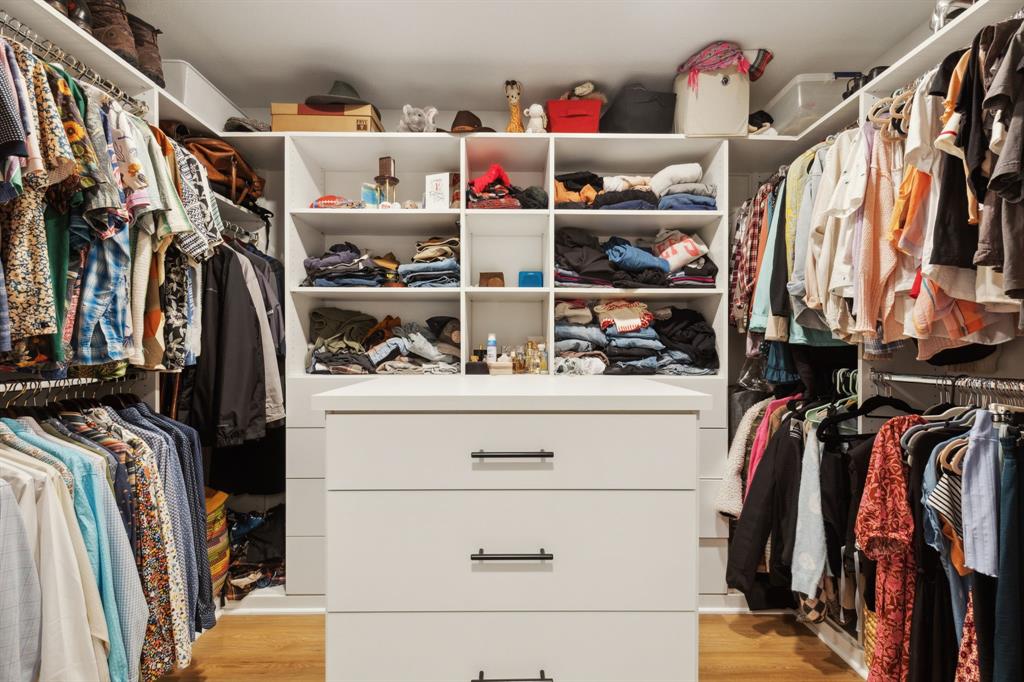 9427 Hobart Street Dallas, TX 75218 - Photo 16 of 25 a view of walk in closet with clothes and shoes
