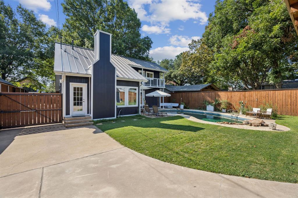 9427 Hobart Street Dallas, TX 75218 - Photo 24 of 25 a view of a house with a yard and a patio