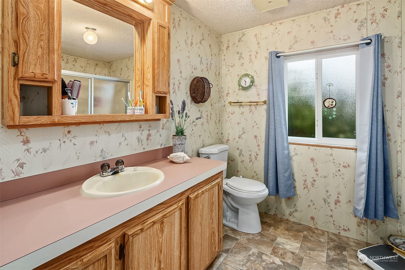 5810 Fleming Street, Unit 33 Everett, WA 98203 - Photo 16 of 28 a bathroom with a sink a toilet and shower