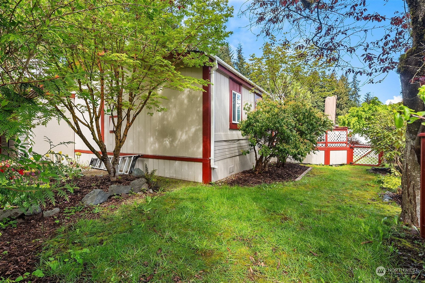 5810 Fleming Street, Unit 33 Everett, WA 98203 - Photo 21 of 28 a view of backyard with a barn and large trees