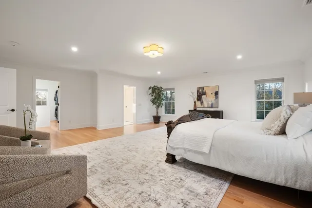 a bedroom with a large bed and a couch