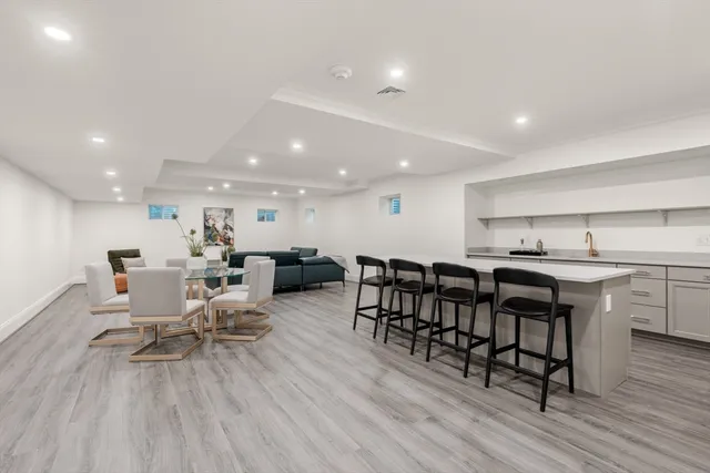 a kitchen with lots of counter top space and furniture