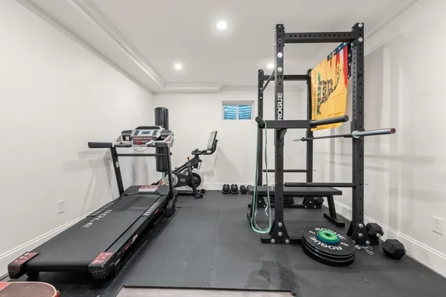 a room with gym equipment and a large window