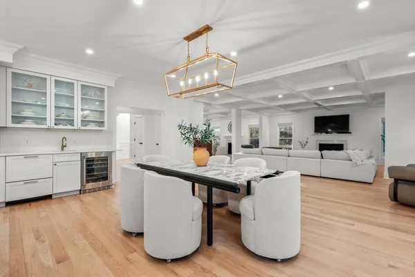 a kitchen with stainless steel appliances granite countertop a sink cabinets and wooden floor