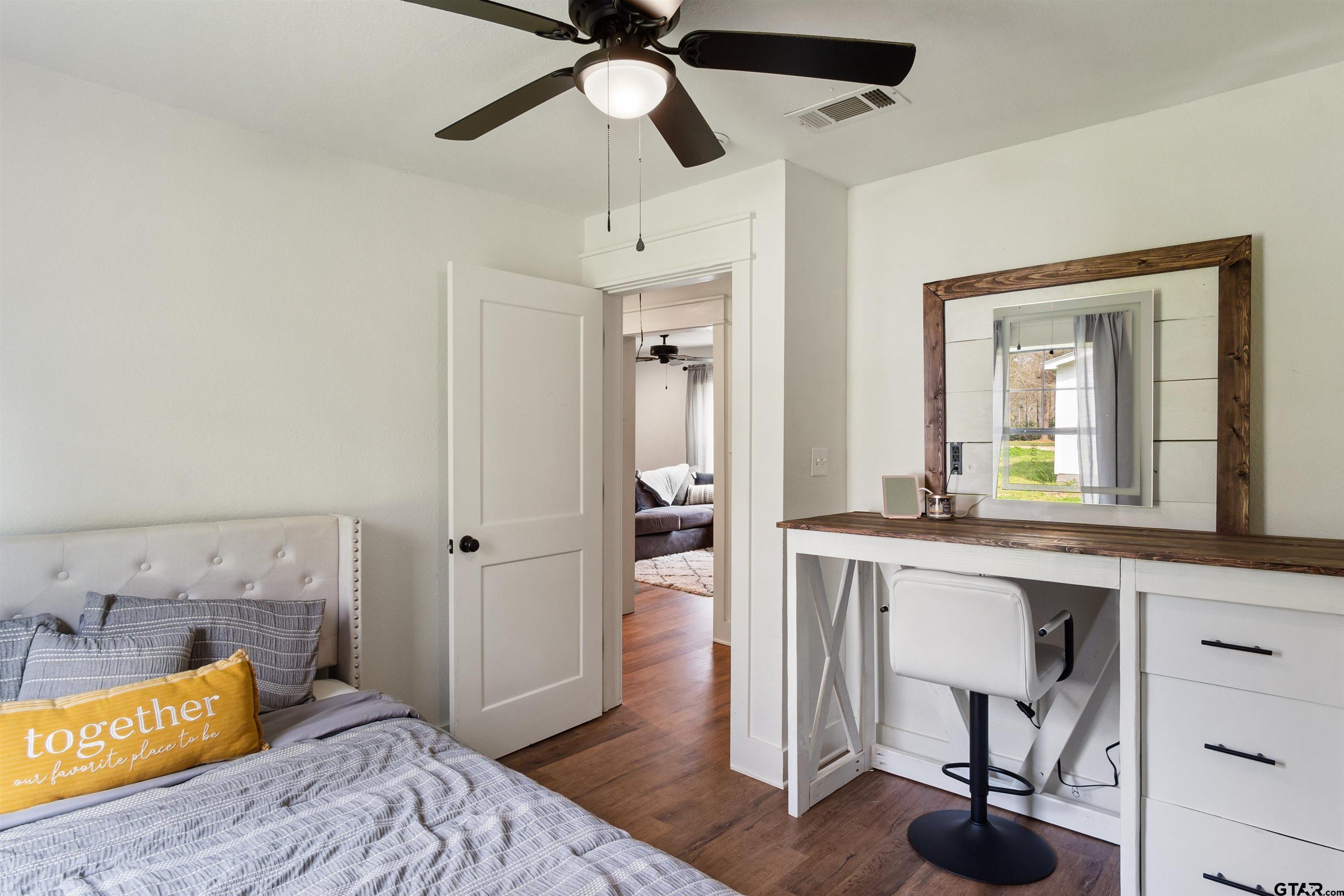 232 Farm To Market 1248 Rusk, TX 75785 - Photo 14 of 19 a bedroom with a bed and a chandelier