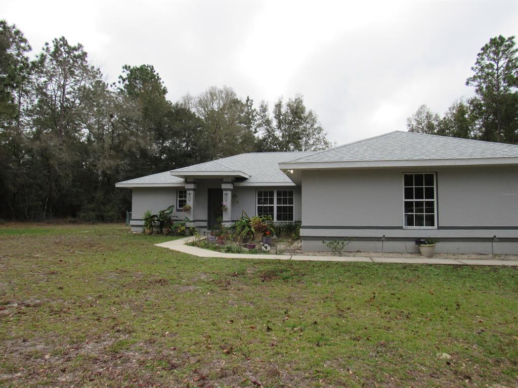 21890 Southwest 80th Pl Road Dunnellon, FL 34431 - Photo 1 of 1 Front of house from driveway