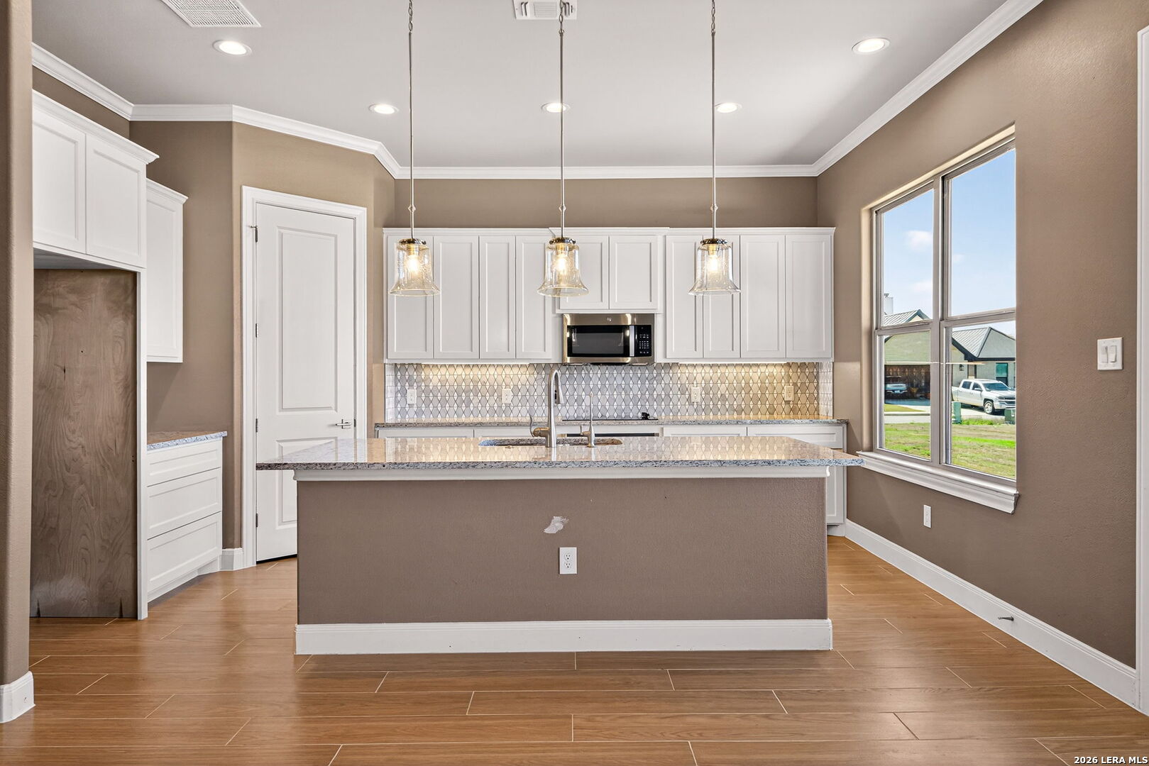 123 John T Court Castroville, TX 78009 - Photo 15 of 45 a view of kitchen with stainless steel appliances granite countertop a stove and a refrigerator