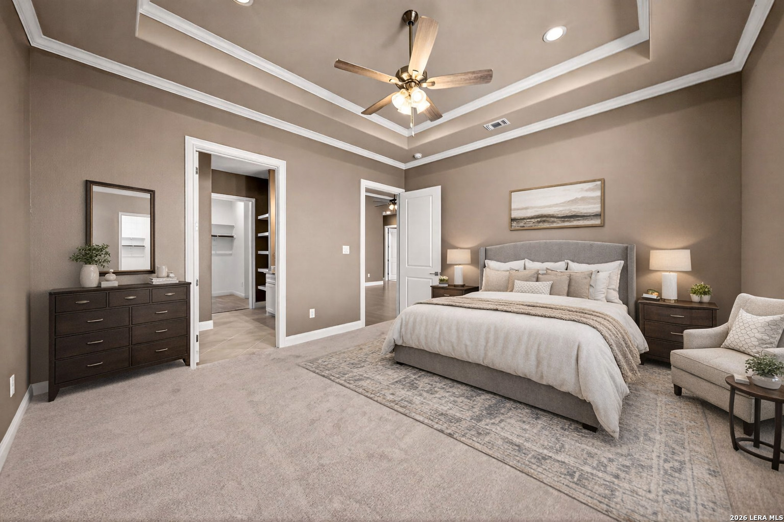 123 John T Court Castroville, TX 78009 - Photo 18 of 45 a spacious bedroom with a bed and a dresser