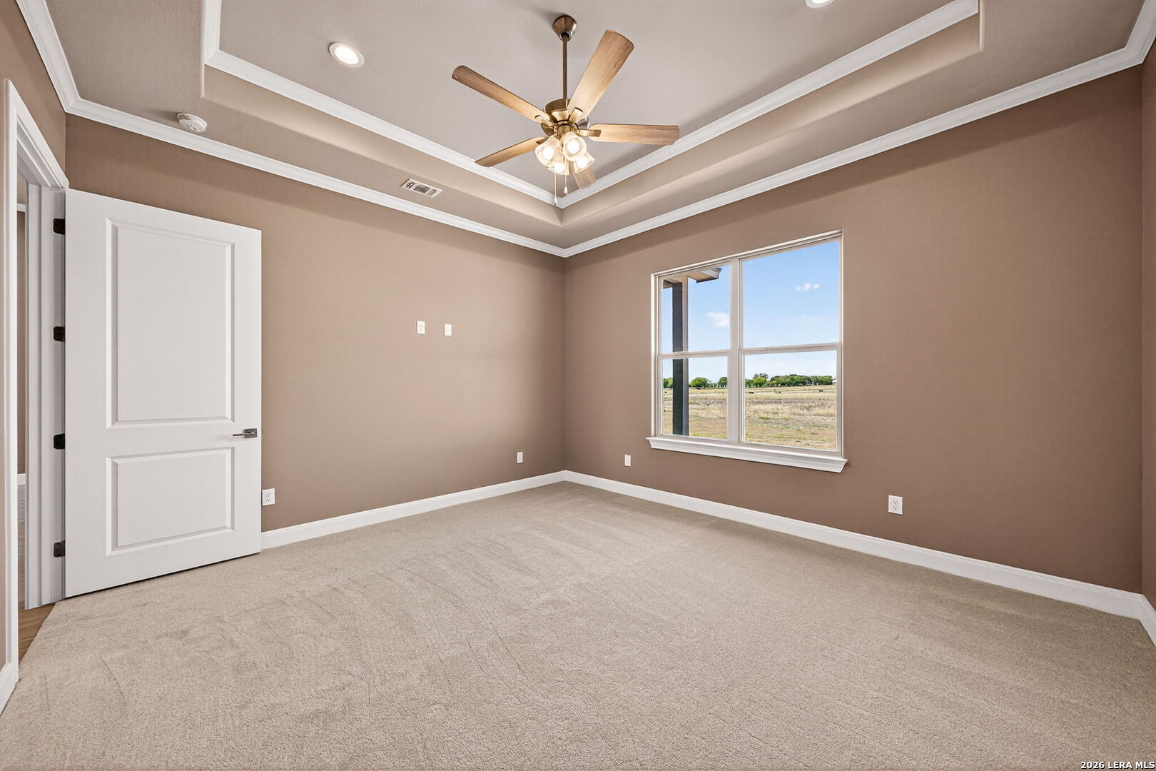 123 John T Court Castroville, TX 78009 - Photo 19 of 45 a view of an empty room with a window
