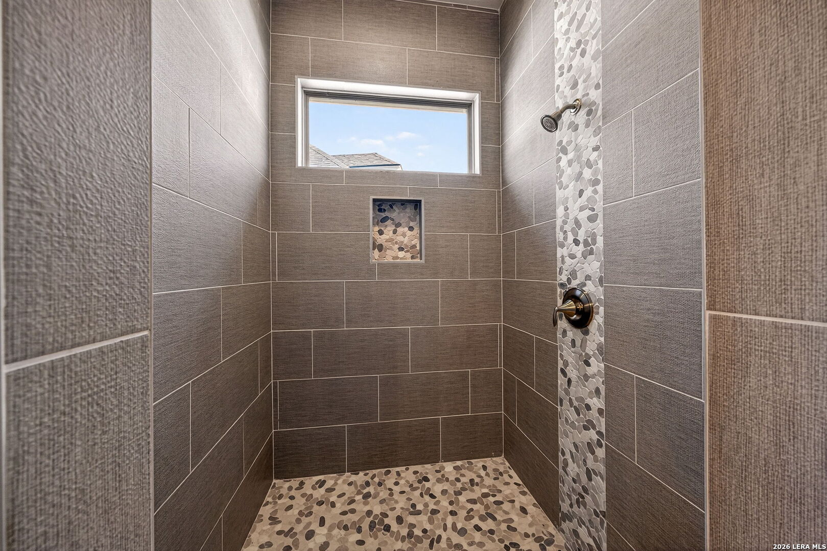 123 John T Court Castroville, TX 78009 - Photo 22 of 45 a bathroom with a shower