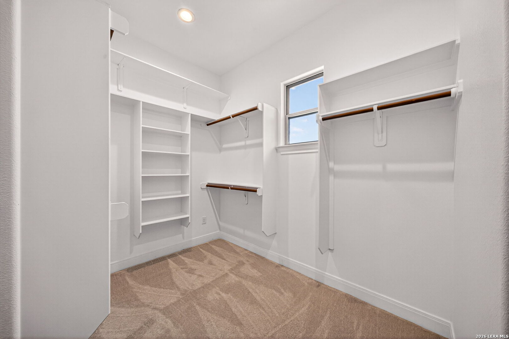 123 John T Court Castroville, TX 78009 - Photo 24 of 45 a view of walk in closet with empty racks