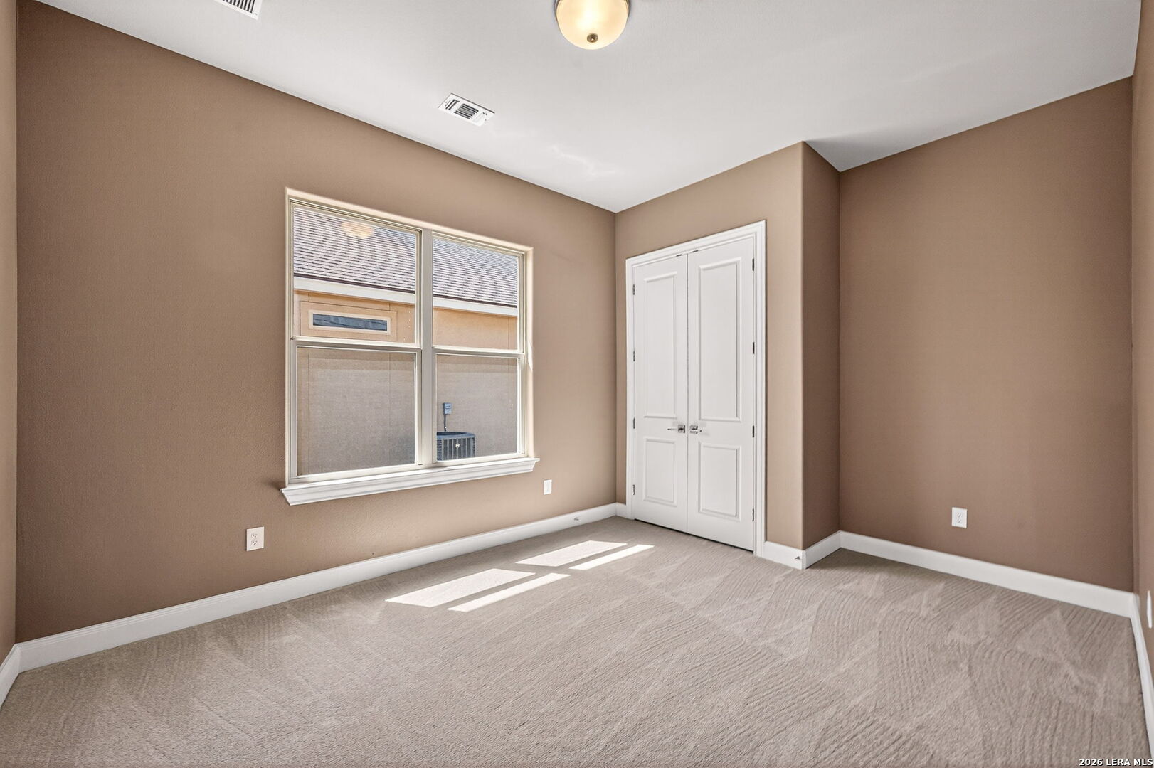 123 John T Court Castroville, TX 78009 - Photo 25 of 45 an empty room with windows and closet