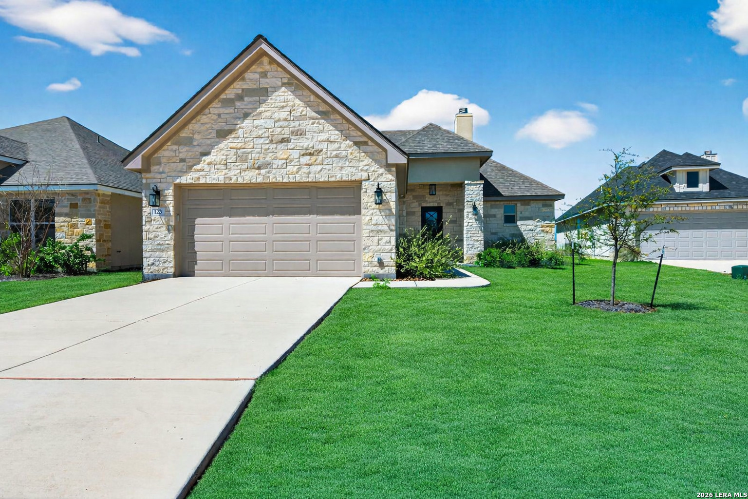 123 John T Court Castroville, TX 78009 - Photo 3 of 45 a view of a house with a yard