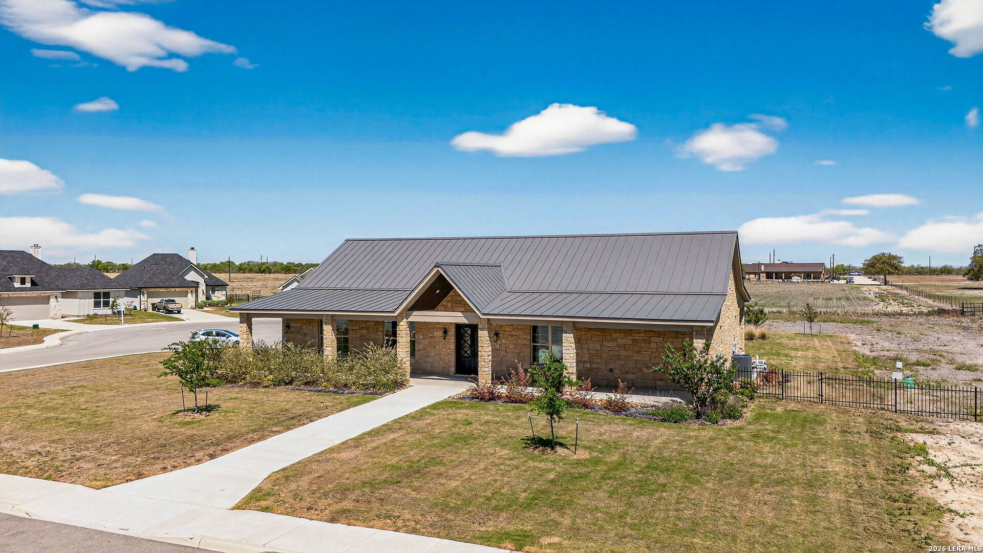 123 John T Court Castroville, TX 78009 - Photo 37 of 45 a front view of a house with a yard