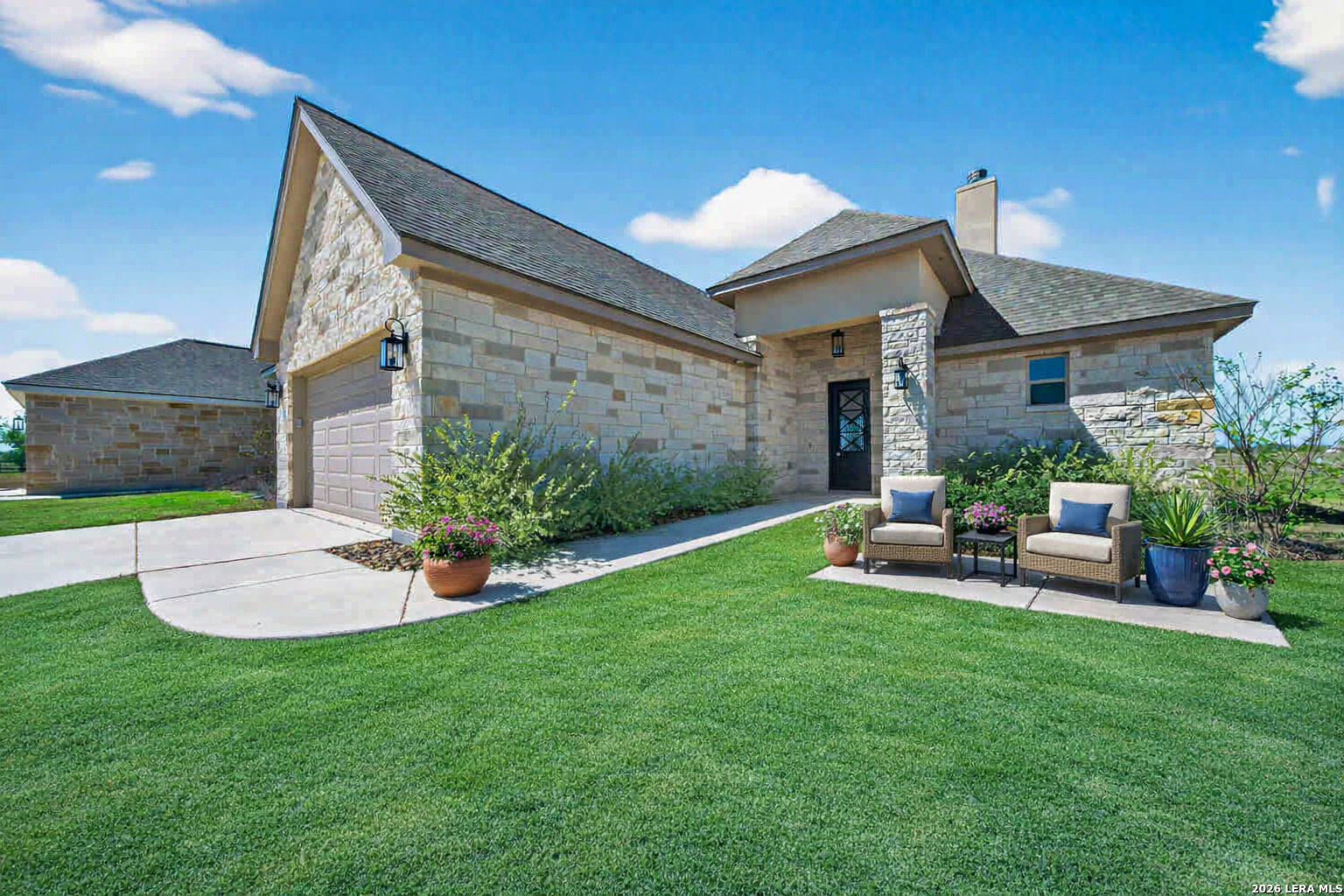 123 John T Court Castroville, TX 78009 - Photo 5 of 45 a view of a house with a yard and porch